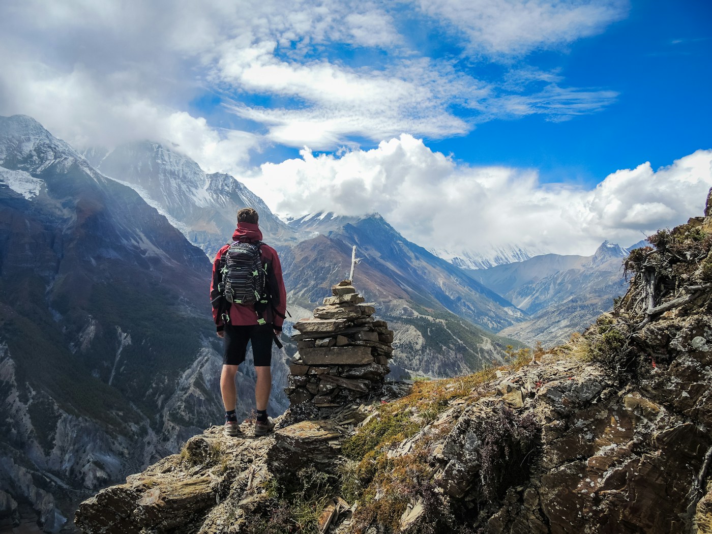 Traveler standing near a mountain viewpoint
